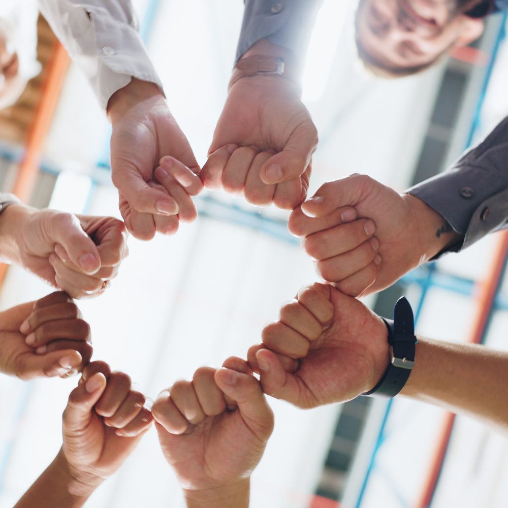 People,,Hands,And,Fist,Bump,In,Workplace,For,Teamwork,,Collaboration