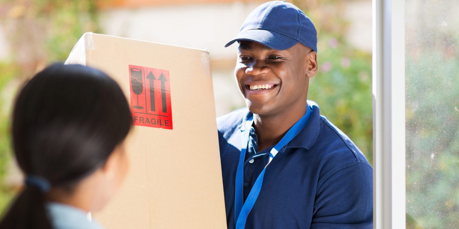 Friendly,Young,African,American,Delivery,Man,Delivering,A,Package